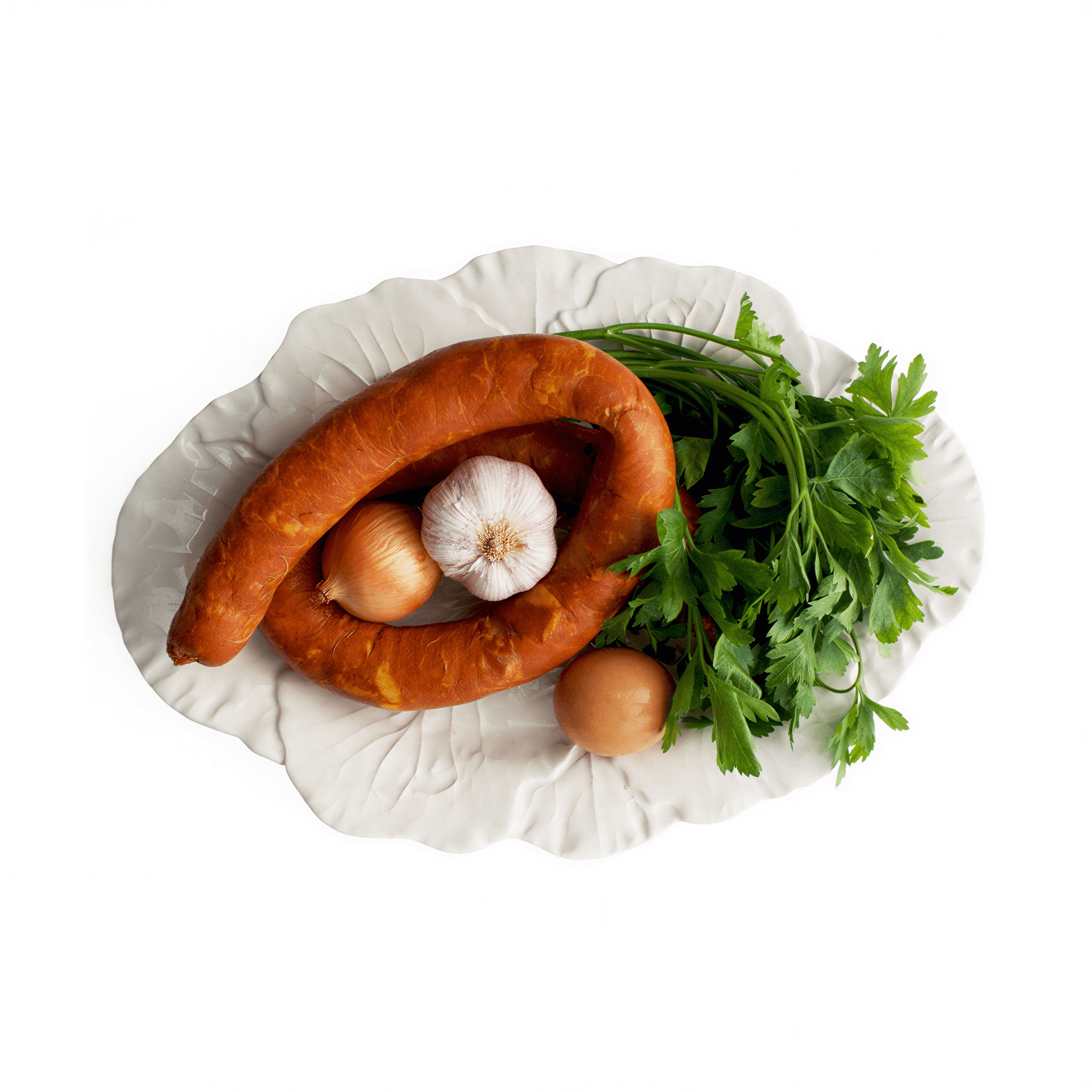 A traditional Portuguese sausage, Linguiça, displayed on a plate with parsley, garlic, and an onion.