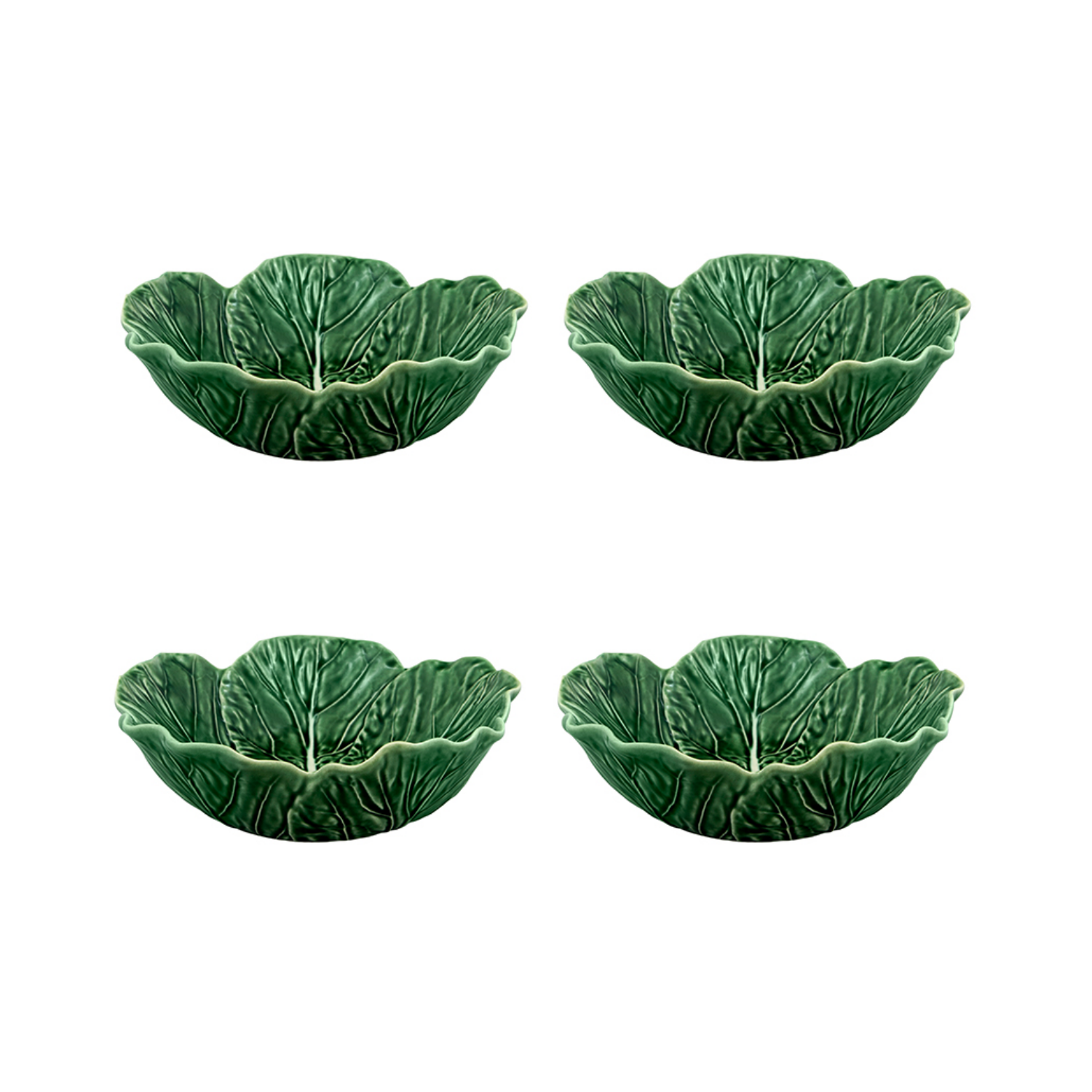 Four green ceramic leaf-shaped bowls on a white background