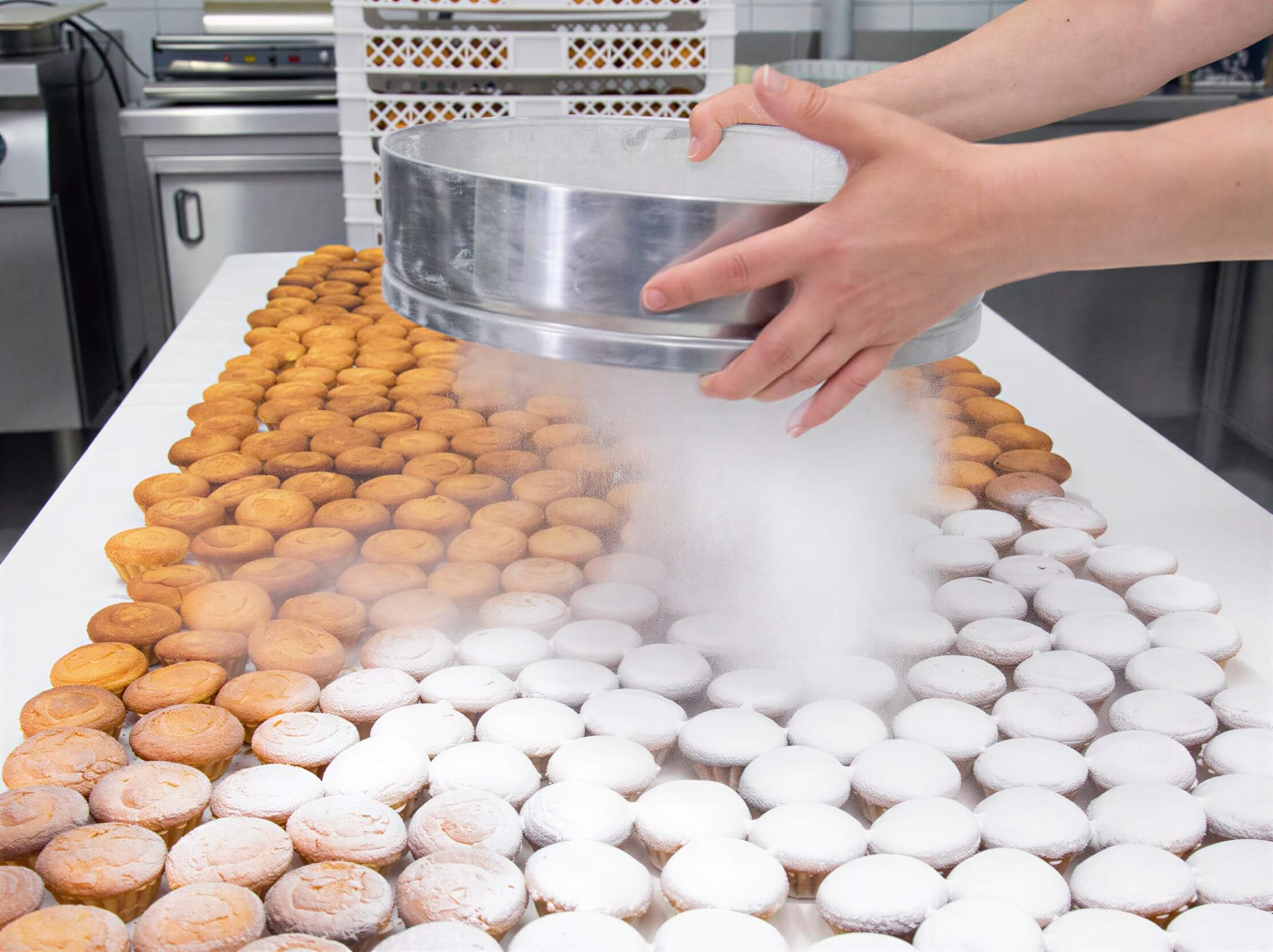 Worker making Queijadas De Vila Franca Do Campo Do Morgado Portuguese Custard Cakes