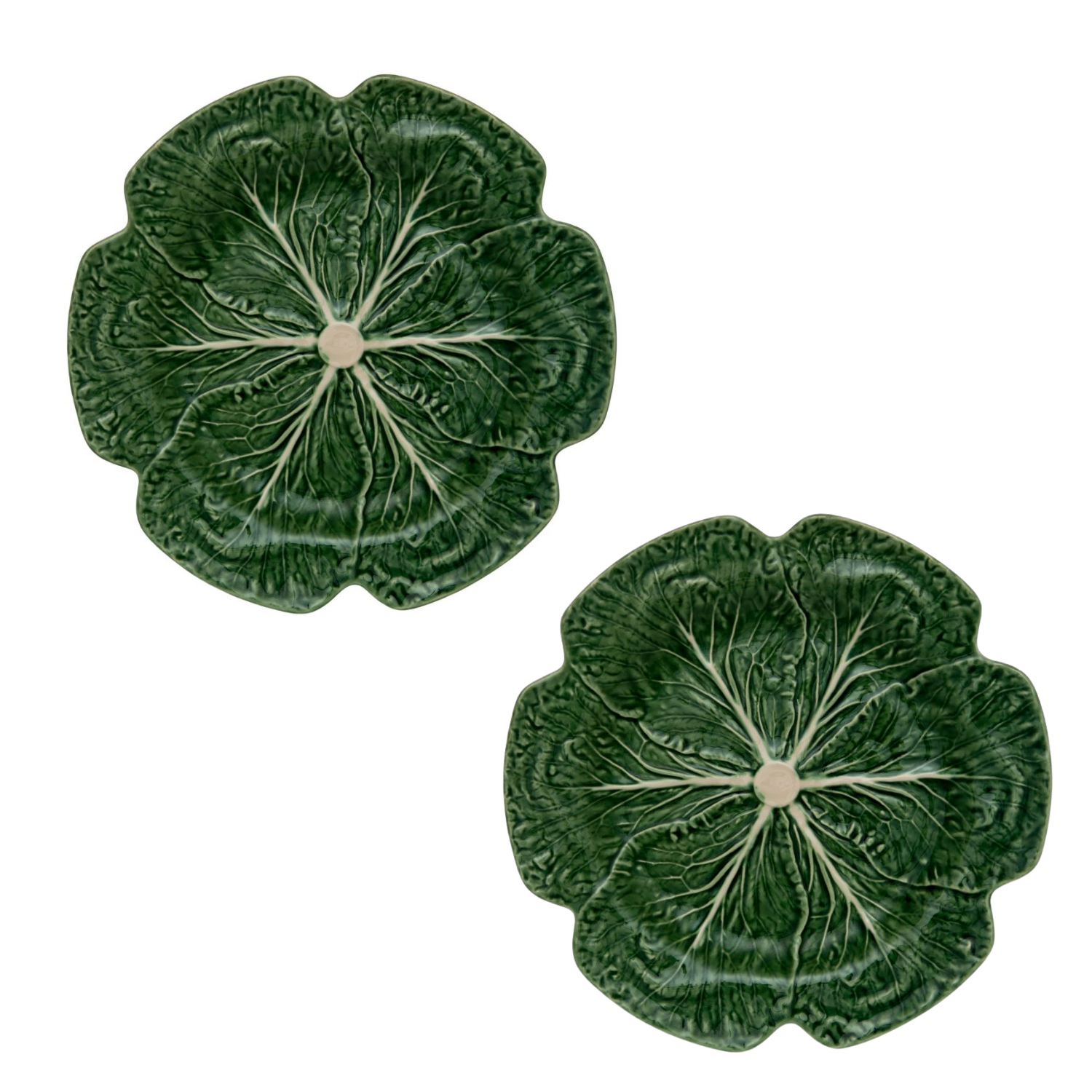Two green ceramic cabbage leaf plates on a white background