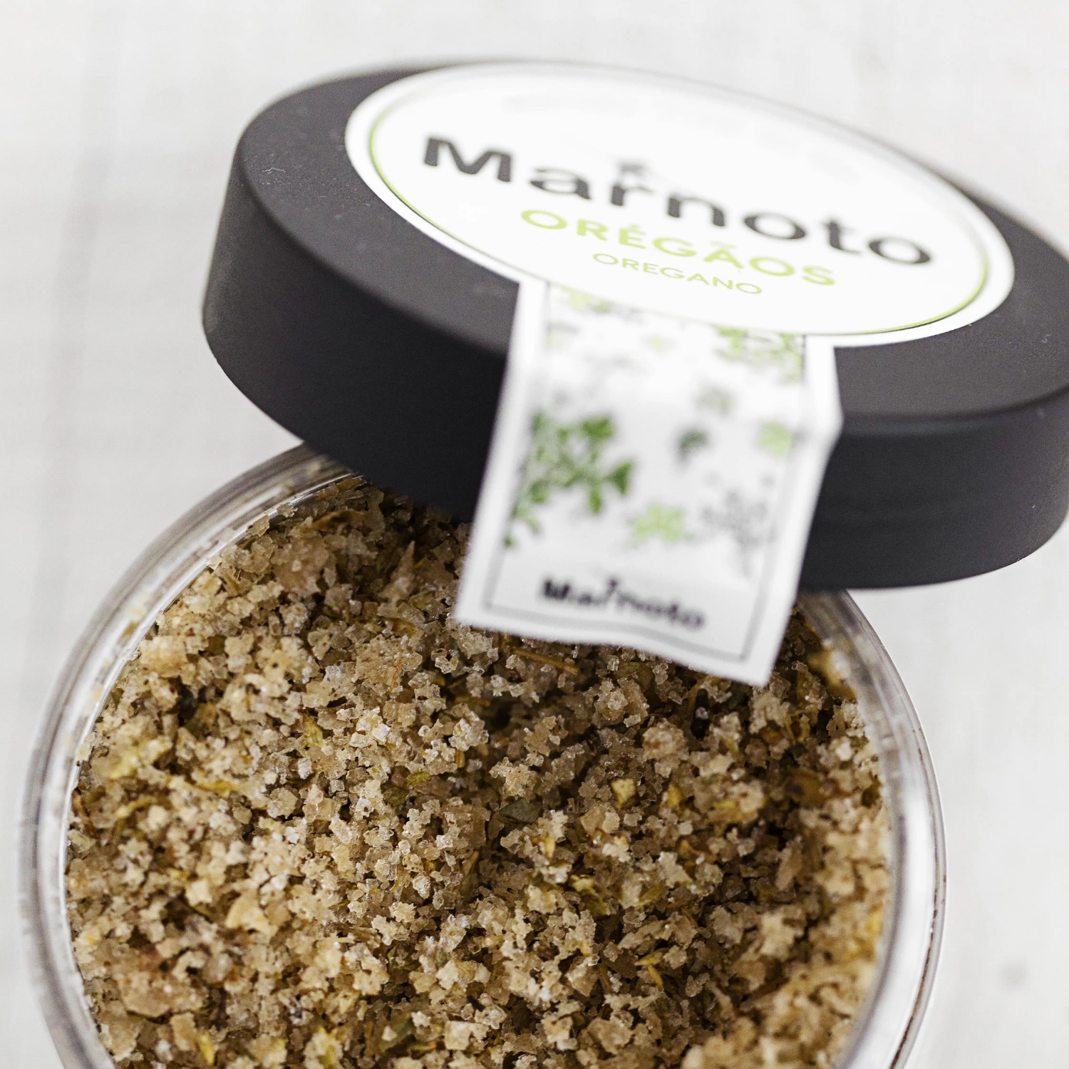 Jar of Marnoto oregano with a label on a white background