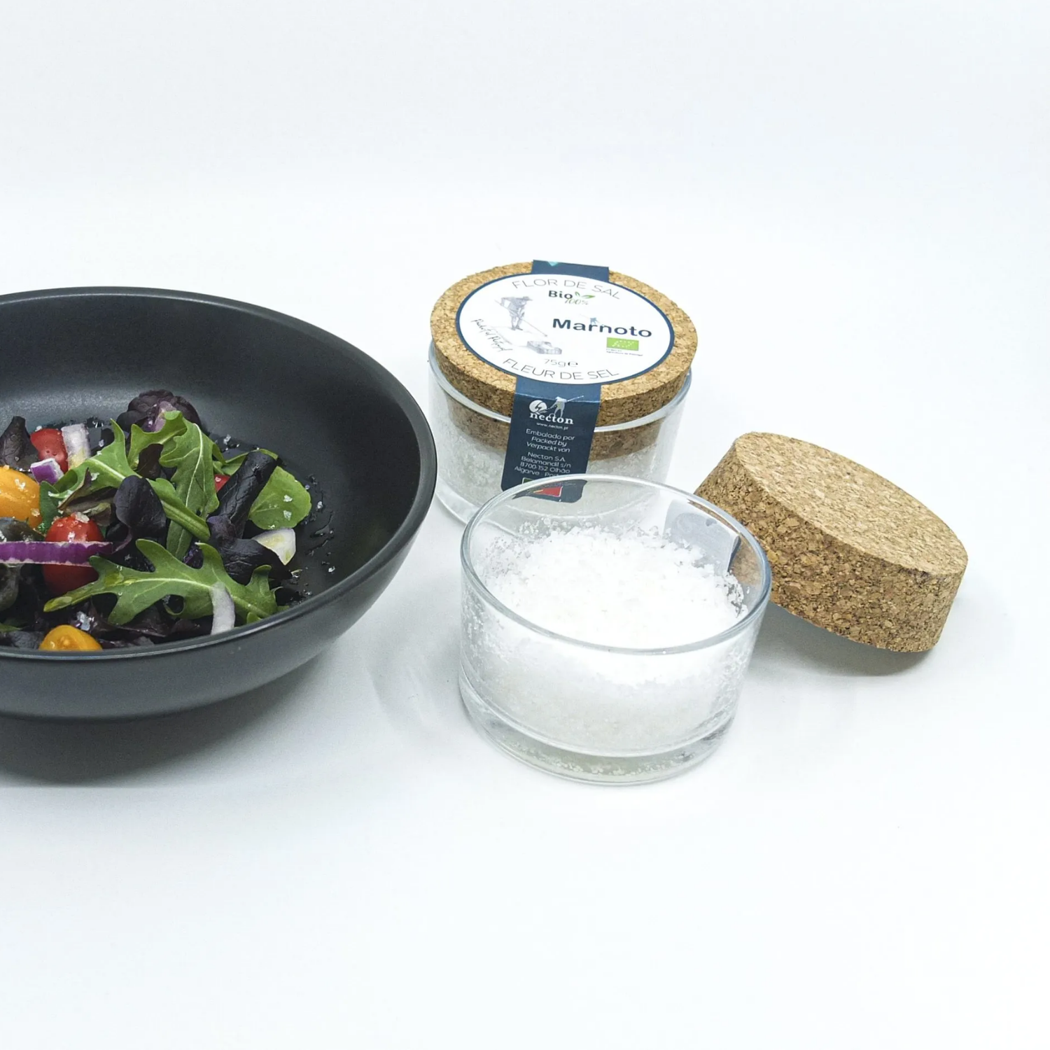 Salad bowl with a jar of Marnoto on a white background