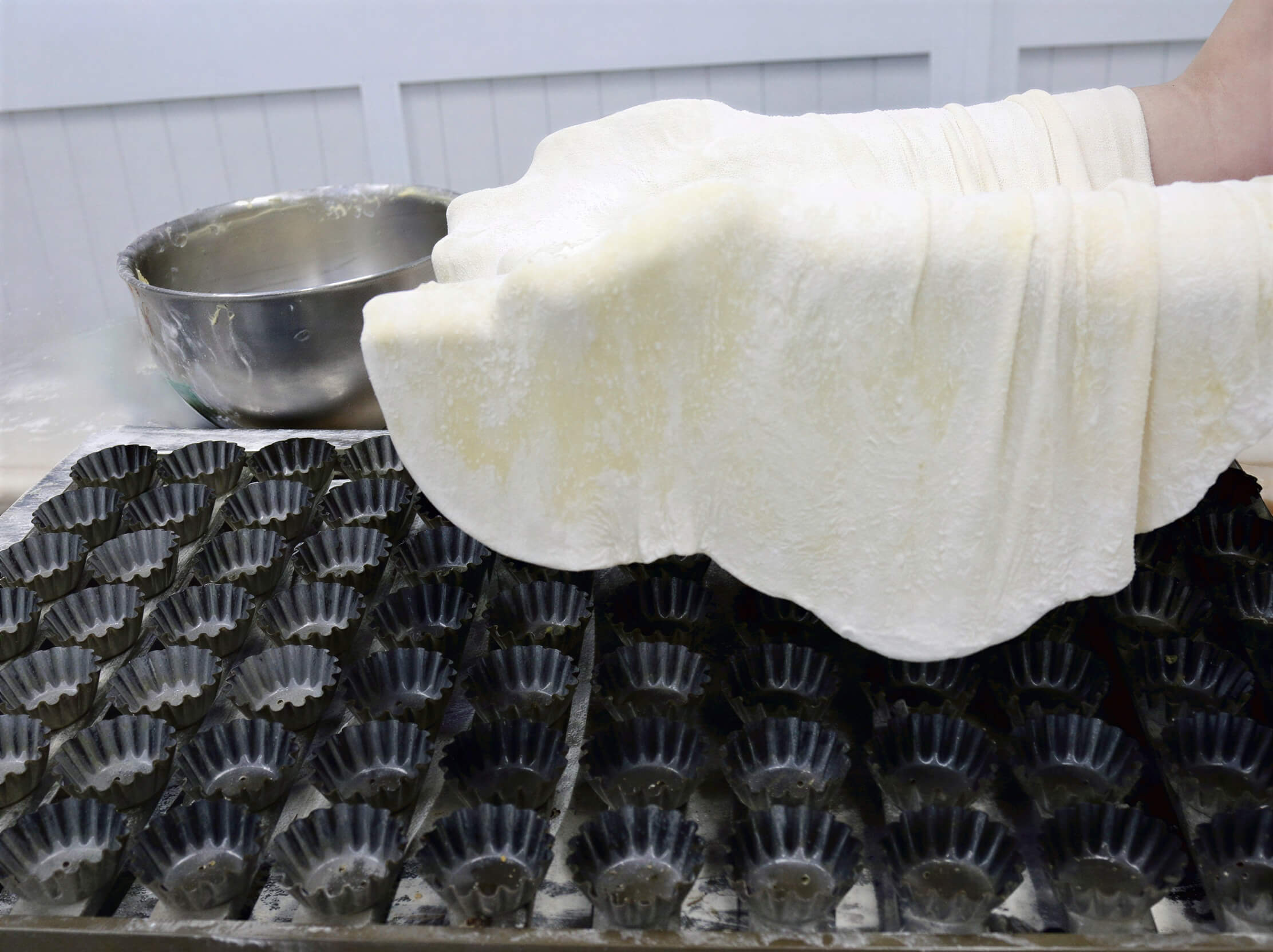 Worker making dough for Queijadas De Vila Franca Do Campo Do Morgado Portuguese Custard Cakes