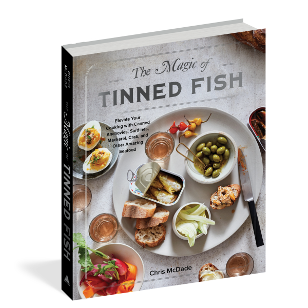 Book titled 'The Magic of Tinned Fish' by Chris McDade on a white background