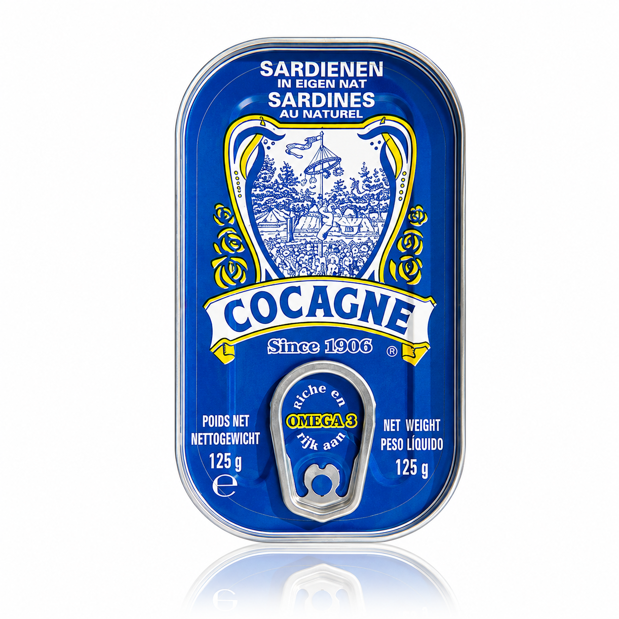 A single can of Cocagne Sardinen in Eigen Nat (Sardines) on a white background with a reflection below. The can features a vibrant blue label with a white and yellow illustration of a fishing village and the brand name 'COCAGNE' in a white banner.