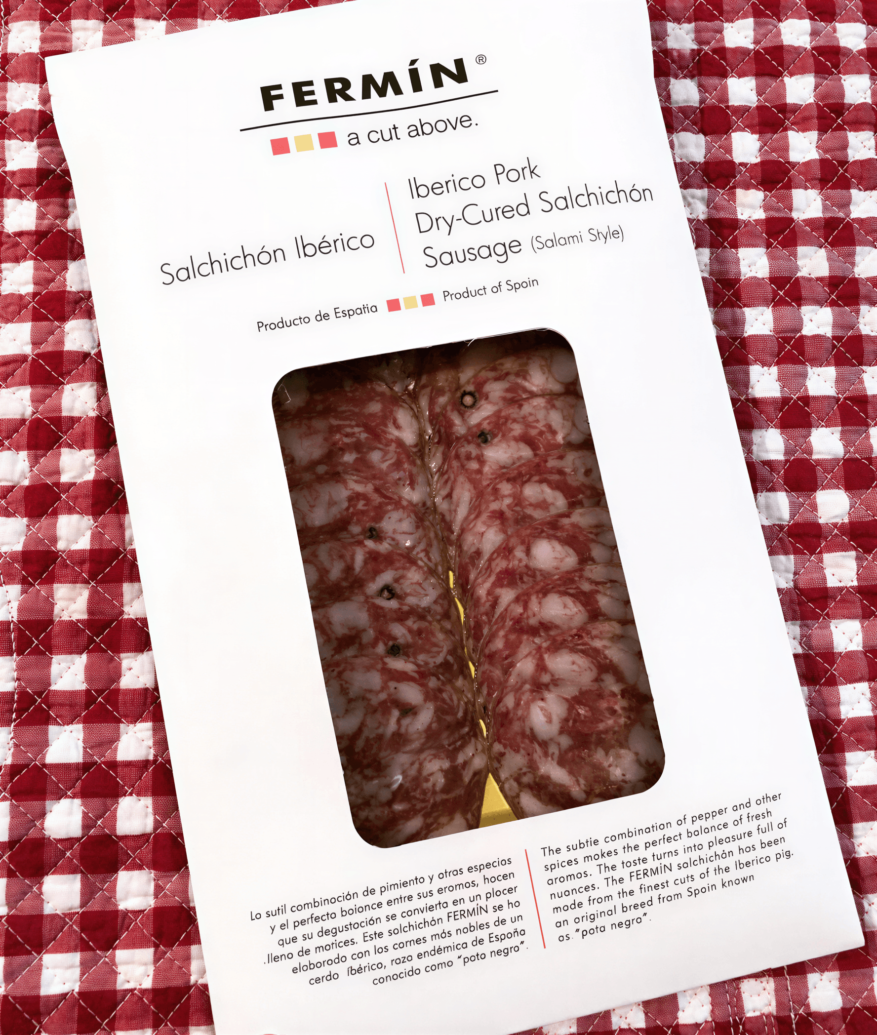 Fermin Iberico salchichon package featuring dry-cured sausage with marbled pink and red meat, labeled in Spanish.
