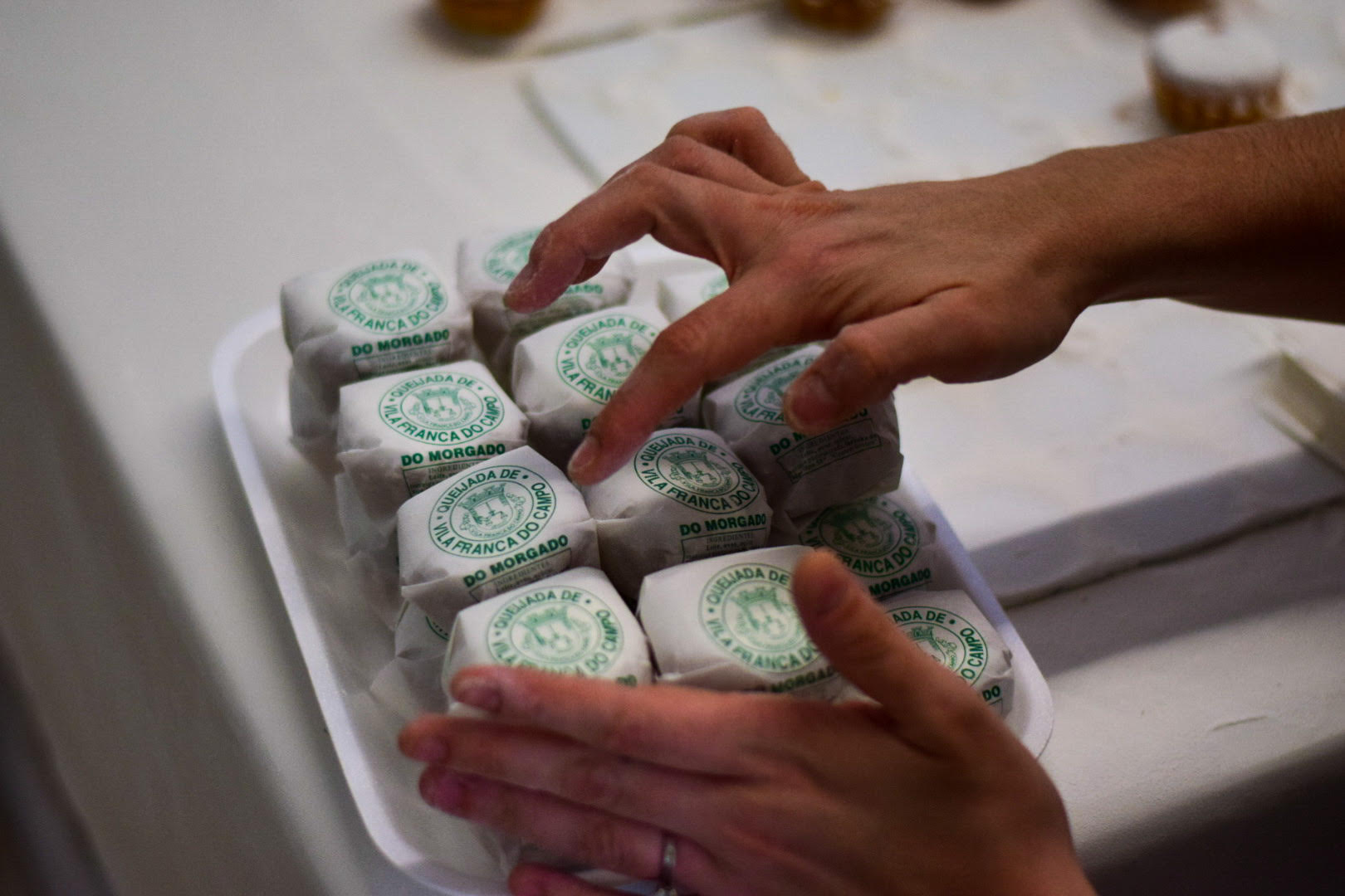 Worker making Queijadas De Vila Franca Do Campo Do Morgado Portuguese Custard Cakes
