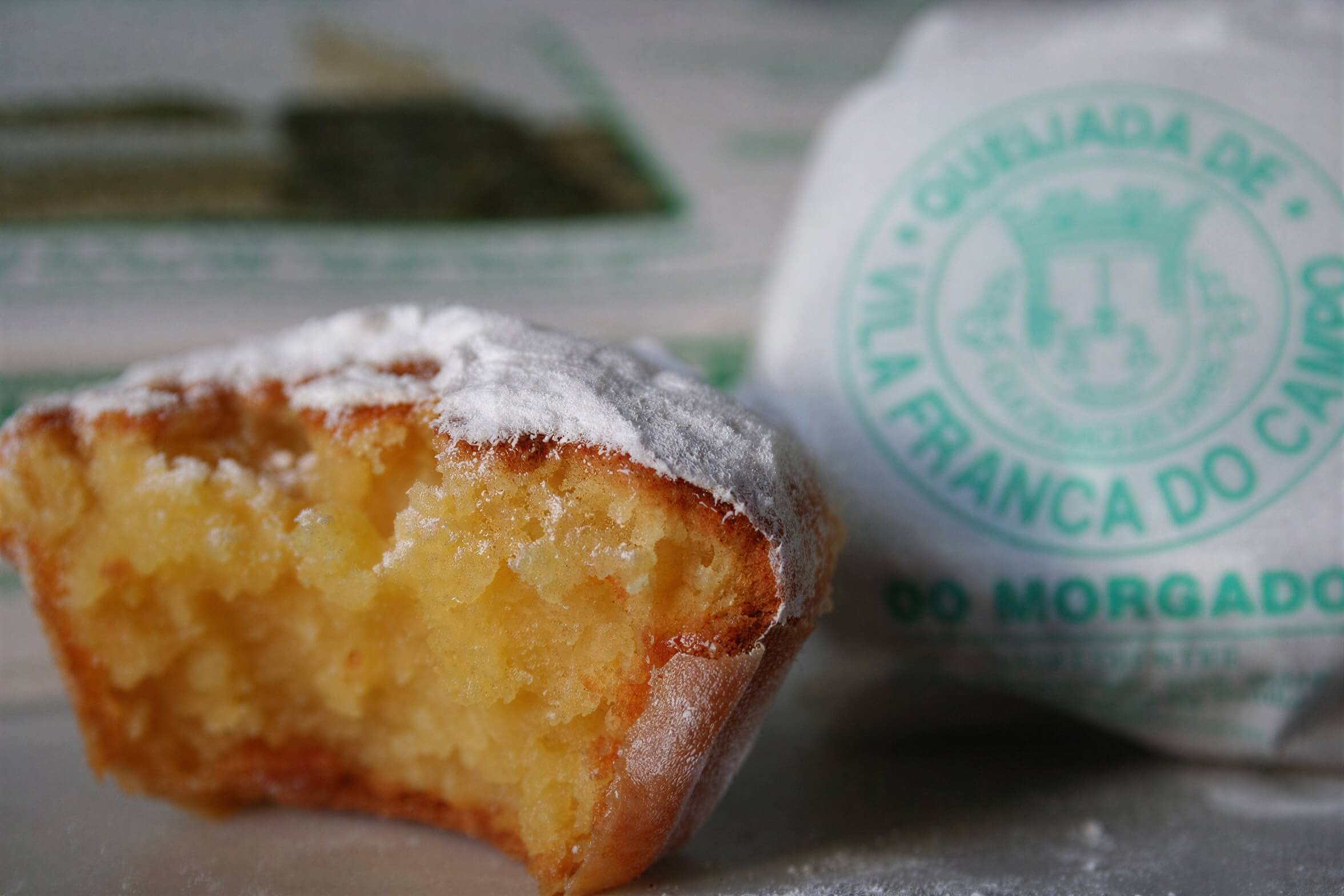 A half eaten Queijadas De Vila Franca Do Campo Do Morgado Portuguese Custard Cakes